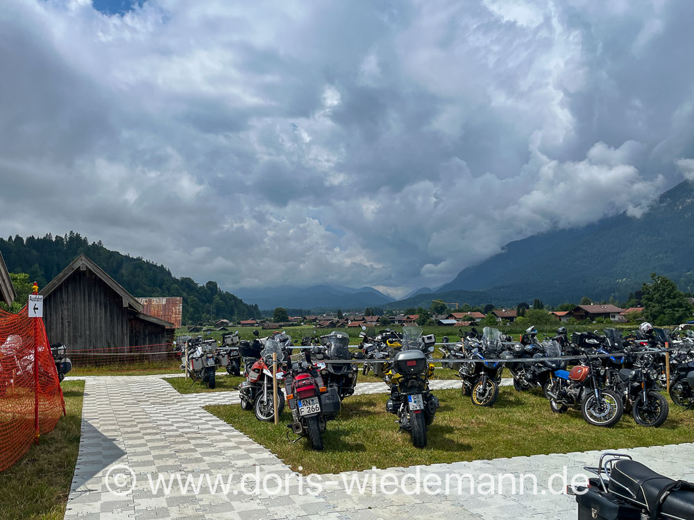 20250704-BMW_Motorrd_Days-IMG_0260 Motorcycle parking lot at the BMW Motorrad Days 2025 in Garmisch-Partenkirchen with a very cloudy sky